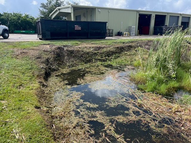Technician performing exterior building maintenance work